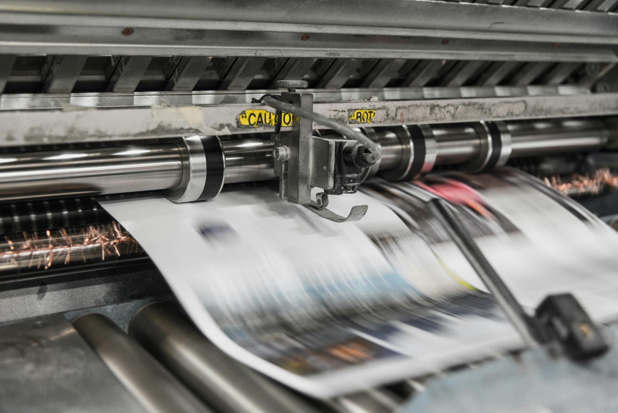 Printed sheets running through a press