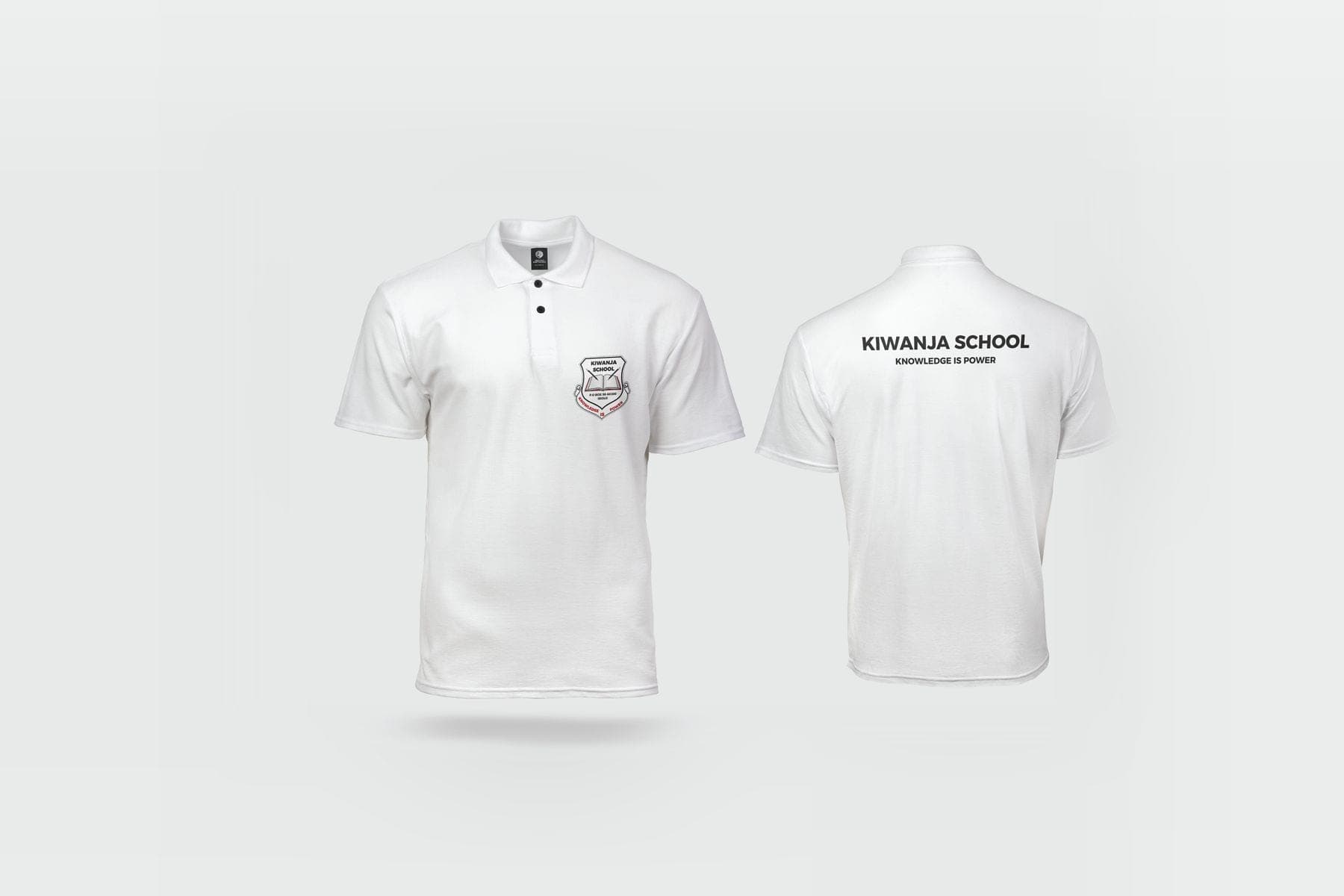 White polo shirts with the Kiwanja School crest on the chest and the name on the back