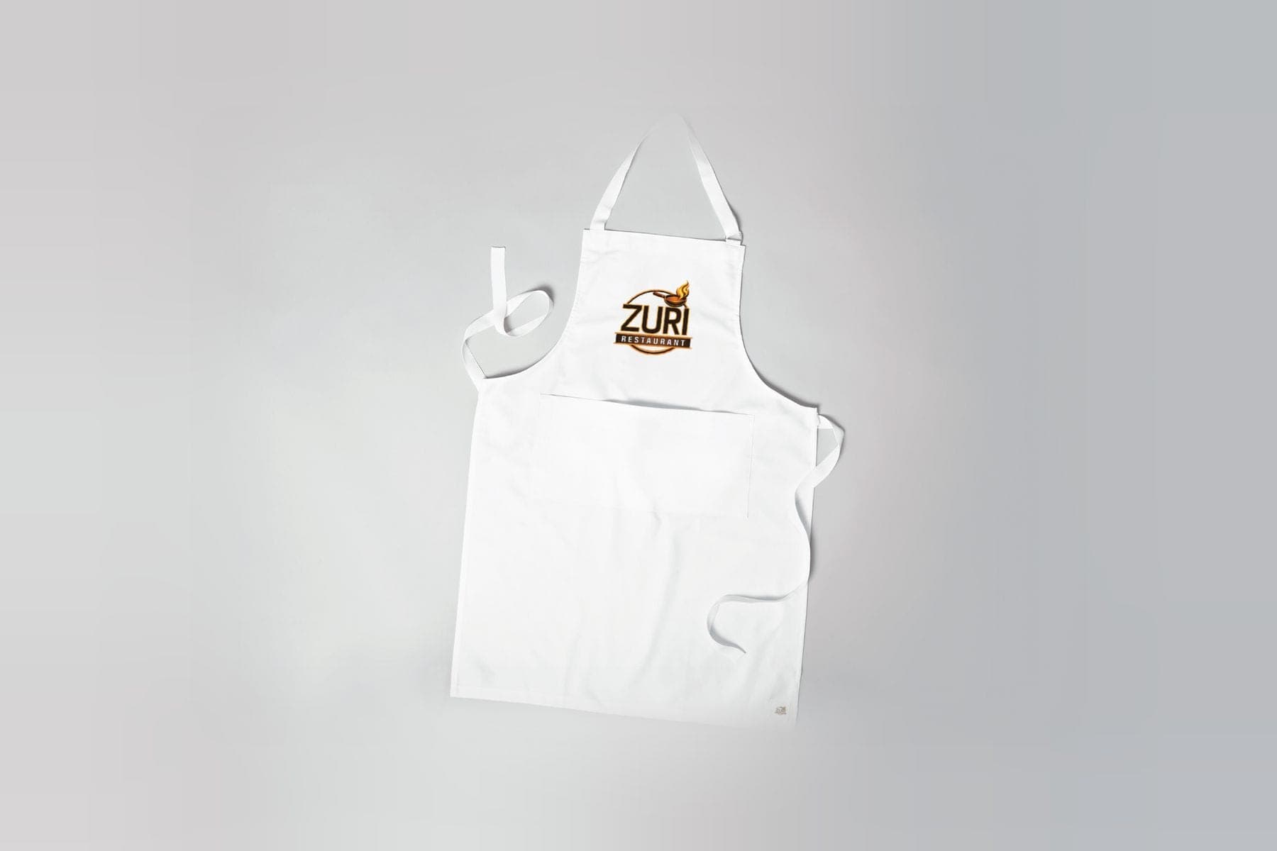 A white apron with the Zuri logo